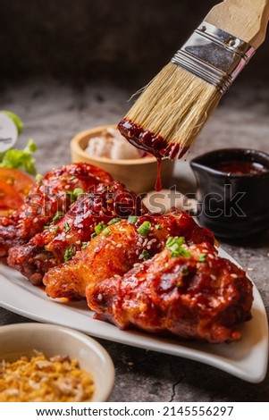 Korean fried chicken drenched in focal point sauce