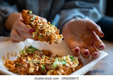 Korean Fried Chicken Tender With Hands Holding