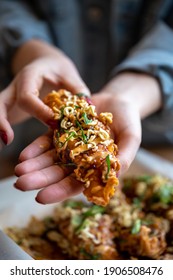 Korean Fried Chicken Tender With Hands Holding