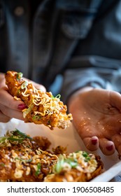 Korean Fried Chicken Tender With Hands Holding