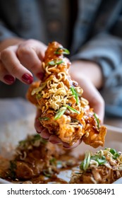 Korean Fried Chicken Tender With Hands Holding