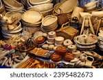 Korean handicraft at Nambu Market in Jeonju, South Korea. Sokuri bamboo woven baskets, boxes, wooden kitchenware and straw slippers.