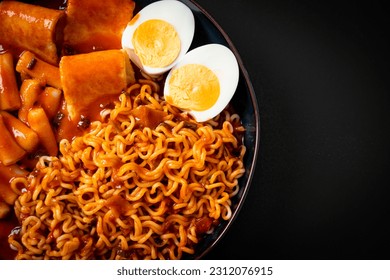 Korean instant noodles with Korean rice cake and fish cake and boiled egg - Rabokki - Korean food style - Shutterstock ID 2312076915