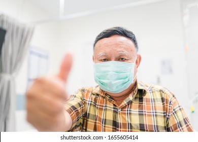 Korean Old Man 60 Years Old Wearing Mask Protection Mask.Asian Old Man Show Thumbs Up Gesture For Good.Super Spreader Man And Covid-19 Dangerous Virus In 2020.Coronavirus And Epidemic Virus Symptoms.