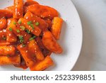 Korean rice cake stick with sausage in spicy sauce (Tteokbokki) - Korean food style