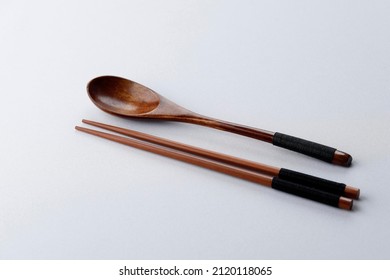 Korean Spoon and Chopstick Wooden Cutlery Isolated on White Table, Copy Space, Eat Concept