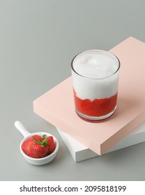 Korean strawberry milk captured from high angle served in clear glass. Korean strawberry milk so refreshing made from fresh strawberry and milk.