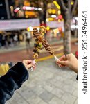 Korean street food of grilled meat on a stick