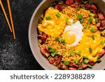 Korean style instant noodle, Shin Ramyeon with sausages, cheese, egg and green onions