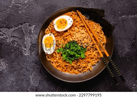 Korean style instant noodle, Shin Ramyeon with peanut and egg, top view.