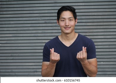 Korean Symbol Hand Heart, A Message Of Love Hand Gesture. Handsome Asian Man With The Hands Folded Into A Heart Symbol