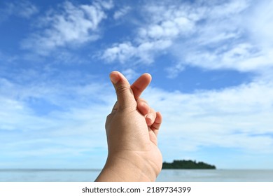 Korean Symbol Of Love With Your Fingers. Love Sign With Finger On Blue Sky Background