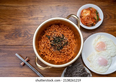 Korean traditional Ramyeon noodle in a traditional korean noodle pot, Spicy Korean Ramyeon instant noodle a traditional dish.