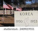 Korean War Memorial in Cemetery With American Flag. Memorial Cemetery in Tyler TX