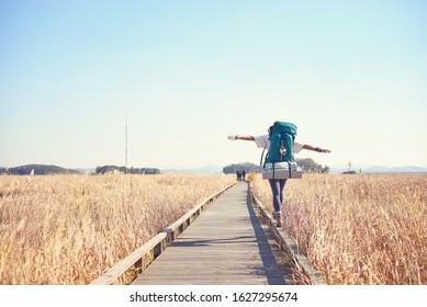 Korean woman is backpacking on an island in Korea. - Shutterstock ID 1627295674