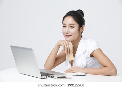 Korean Woman Browsing And Shopping Online