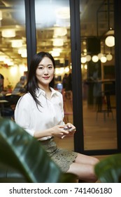 Korean Woman Using Phone 