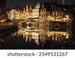 Korenlei dock night reflection in Ghent, Flemish Region, Belgium. Mirror picture. Water reflection.