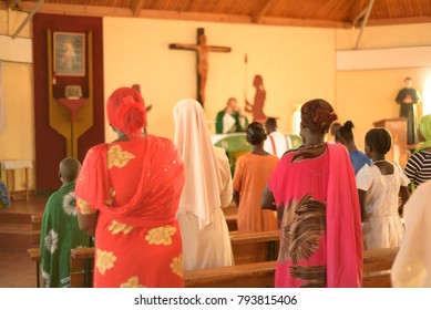 Korr, Marsabit County, Kenya - October 2017. Roman Catholic Mass In A Local Church. Women Are Praying During The Mass Celebration. Missionaries In Africa. 