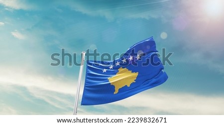 Kosovo Flag on pole for Independence day. The symbol of the state on wavy cotton fabric.