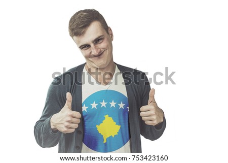 Kosovo flag on shirt of the funny man showing gesture like a hand on an isolated background.