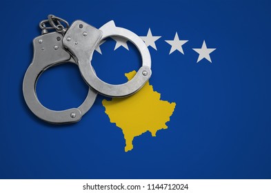 Kosovo Flag  And Police Handcuffs. The Concept Of Crime And Offenses In The Country
