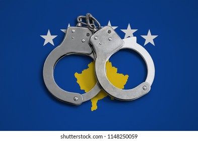 Kosovo Flag  And Police Handcuffs. The Concept Of Observance Of The Law In The Country And Protection From Crime