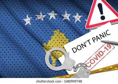 Kosovo Flag And Police Handcuffs With Inscription Don't Panic On White Paper. Coronavirus Or 2019-nCov Virus Concept