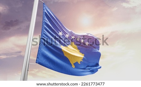Kosovo national flag waving in the sky.