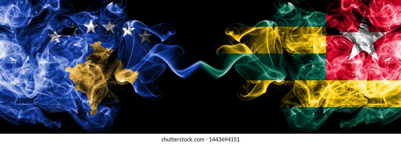 Kosovo vs Togo, Togolese smoky mystic flags placed side by side. Thick colored silky smokes combination of Kosovo and Togo, Togolese flag