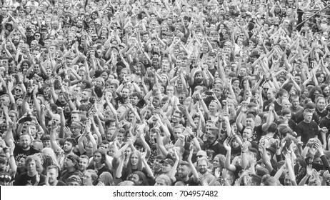 Kostrzyn, Poland - August 05, 2017: Applauding crowd at a concert during the 23rd Woodstock Festival Poland. Festival is among the biggest open air festivals in the world.