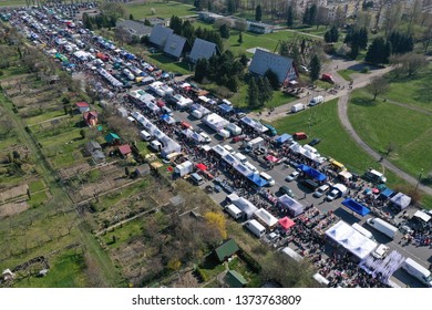 KOSZALIN, POLAND - 07 APRIL 2019 - Aerial view on Koszalin's Gielda miscellaneous sunday market filled with crowds of buyers and seller's makeshift stands.