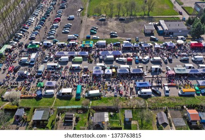KOSZALIN, POLAND - 07 APRIL 2019 - Aerial view on Koszalin's Gielda miscellaneous sunday market filled with crowds of buyers and seller's makeshift stands.