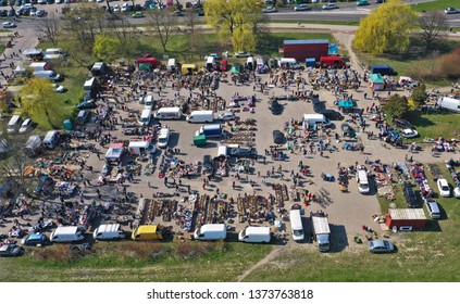 KOSZALIN, POLAND - 07 APRIL 2019 - Aerial view on Koszalin's Gielda miscellaneous sunday market filled with crowds of buyers and seller's makeshift stands.