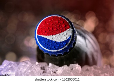Koszalin, Poland - March 3, 2020: closed Pepsi glass bottle close up. Pepsi is popular carbonated soft drink manufactured by PepsiCo
