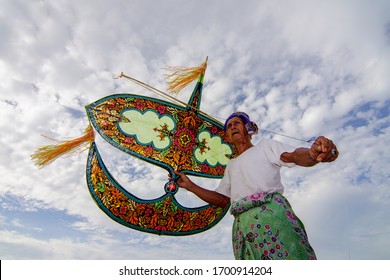 Kota Bahru, Kelantan/Malaysia - Jul 15 2017: A Man Play His Wau Bulan.