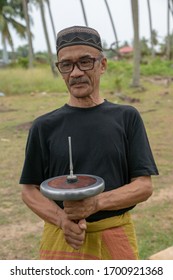 Kota Bahru, Kelantan/Malaysia - Jul 15 2017: A Man Hold Gasing.