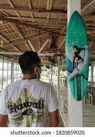 Kota Belud, Sabah/Malaysia-September 14 2020 : Selective Focus On Image Back View Of A Man With Interior Decoration In Cabana Retreat Cafe.Image May Contain Noise Or Grain Due To Low Light.