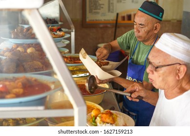 Kota Bharu - January 10 2020 : Malay Man Is Working As A Waiter At Hover Restaurant In Kelantan In Malaysia