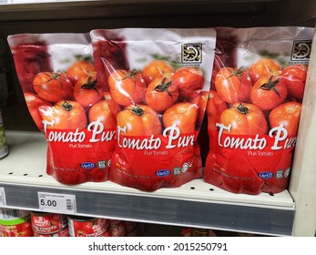 Kota Kemuning, Malaysia - 18 July 2021 : Tomato Pure Packed Display For Sell On The Supermarket Shelf With Selective Focus.