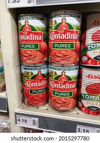 Kota Kemuning, Malaysia - 18 July 2021 : CONTADINA Roma Tomatoes Puree Cans Display For Sell On The Supermarket Shelf With Selective Focus.