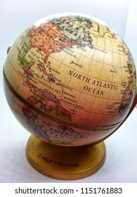 Kota Kinabalu, Malaysia - August 04, 2018; Close Up Shot Of Vintage Globe Model With A Map Of The World Over White Background Isolated.