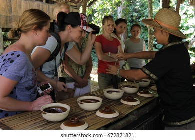 Kota Kinabalu Malaysia - Mar 3, 2014 : Group Of Tourist Looking At Traditional Food Preparation At Mari Mari Cultural Village.Unique Culture And Traditional Foods Is Among Attraction In Sabah.