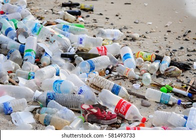 KOTA KINABALU, MALAYSIA - MARCH 13, 2016: Garbage and plastic bottles on a beach left in Kota Kinabalu beach. 