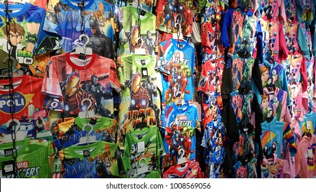 Kota Kinabalu, Malaysia - October 21, 2017: Various Kids T-shirts With Marvel Super Heroes, Avengers, Ironman, Captain America And Ben 10 Prints Are Displayed For Customers To Choose At Shopping Mall