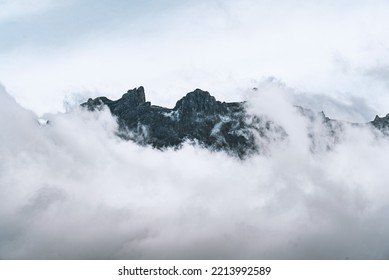 Kota Kinabalu Mountain In Malaysia Surrounded By White Clouds