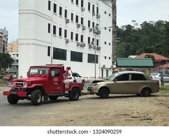 Kota Kinabalu Sabah 6 Feb 2018 . Red Towing Car Was Towing A Car . Be Careful On The Road And Not Involved Ourselves Into Accident. 