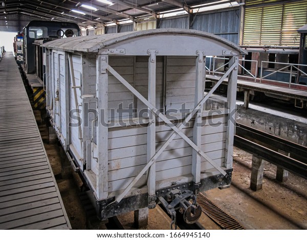 Kota Kinabalu, Sabah, Malaysia - 19 May 2011: Wooden\
freight car of the North Borneo Railways with sliding doors, fleet\
number TV 7775,  in the Depot at the former Railway Workshop in\
Tanjung Aru 