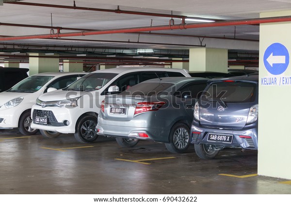 Kota Kinabalu\
Sabah Malaysia - Aug2, 2017 : Car parked at shopping mall parking\
area in Kota Kinabalu. In recent year parking space has become a\
problem for most city in\
Malaysia.