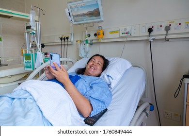 Kota Kinabalu, Sabah, Malaysia - May 30, 2020 : Asian Chinese Female Patient Resting While Playing Smart Phone On The Labour Room After Delivery Newborn Baby In Hospital At Kota Kinabalu, Sabah, Malay